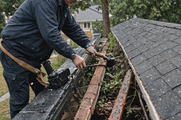 Emergency gutter repair team responding to storm damage